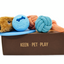 A collection of dog toys including a plush toy, three rope toys, a frisbee, and a treat ball. The toys are designed to relieve boredom and provide entertainment for dogs. This dog toy box is a perfect birthday gift for dog lovers and their furry friends. The toys are brightly colored and made from high-quality materials to ensure durability and long-lasting fun.